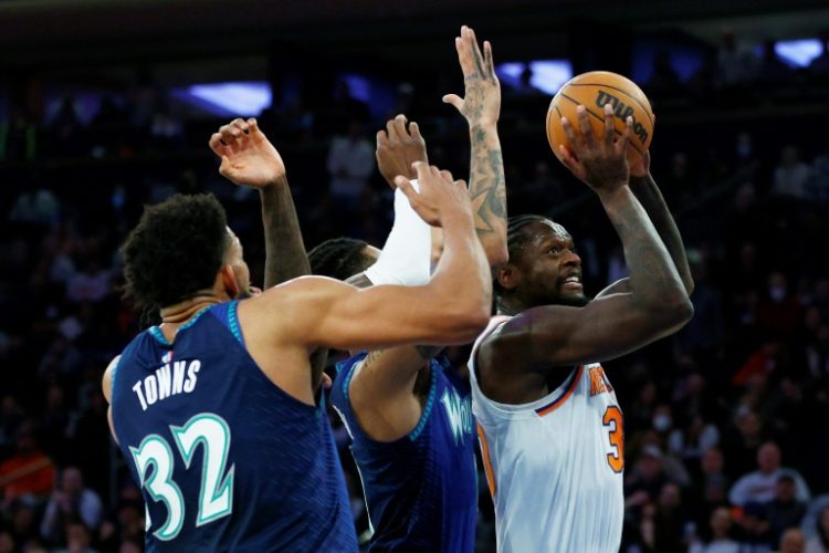 New York's Julius Randle, right, was traded to the Minnesota Timberwolves in an NBA deal that brought Karl-Anthony Towns, left, to the Knicks. ©AFP