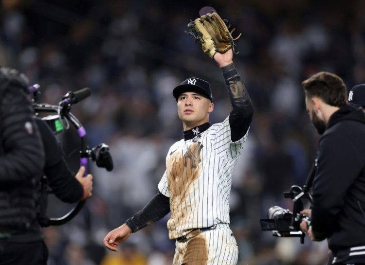 Anthony Volpe of the New York Yankees waves to the crowd of fans that was chanting his name after helping his hometown team beat the Los Angeles Dodgers in the World Series. ©AFP