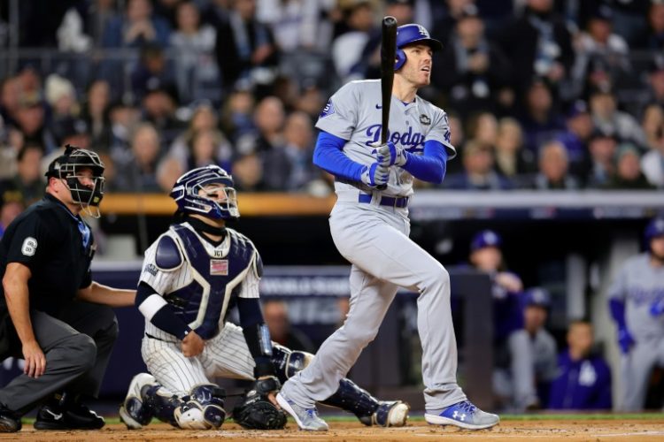 Los Angeles slugger Freddie Freeman watches his two-run homer in the first inning that helped the Dodgers to victory over the New York Yankees in game three of the World Series. ©AFP