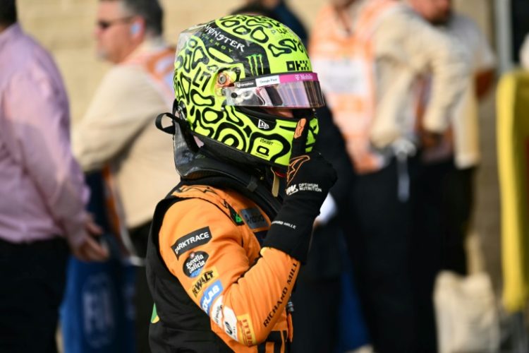 McLaren's Lando Norris celebrates his pole position after qualifying for the United States Formula One Grand Prix. ©AFP