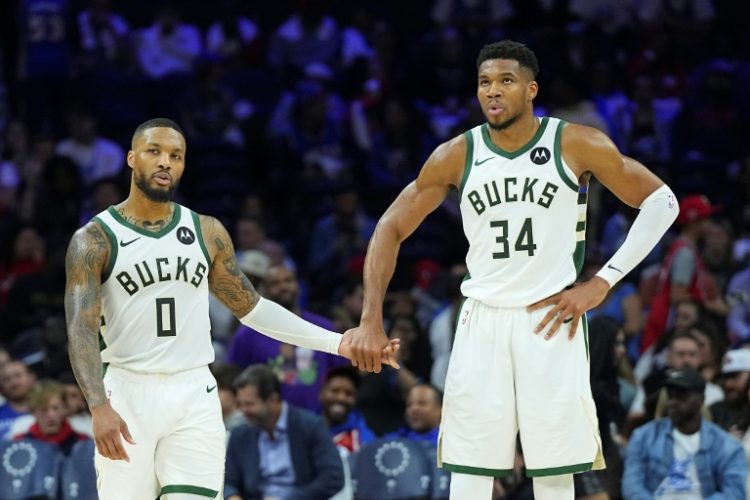 Milwaukee's Damian Lillard and Giannis Antetokounmpo celebrate during the Bucks' NBA victory over the Philadelphia 76ers. ©AFP