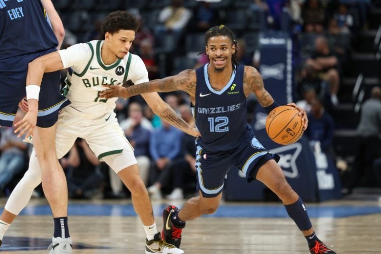 Ja Morant of the Memphis Grizzlies drives against Milwaukee's Ryan Rollins in the Grizzlies' NBA victory over the Bucks. ©AFP