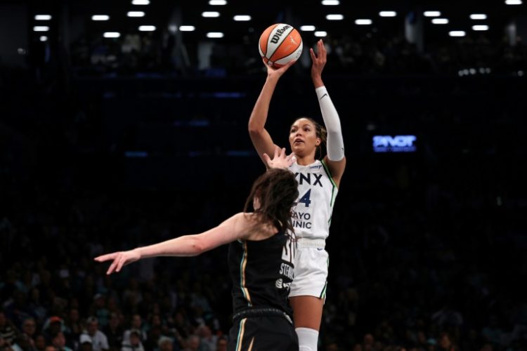 Napheesa Collier of the Minnesota Lynx fires a shot over Breanna Stewart in Minnesota's victory over the New York Liberty in game one of the WNBA Finals. ©AFP