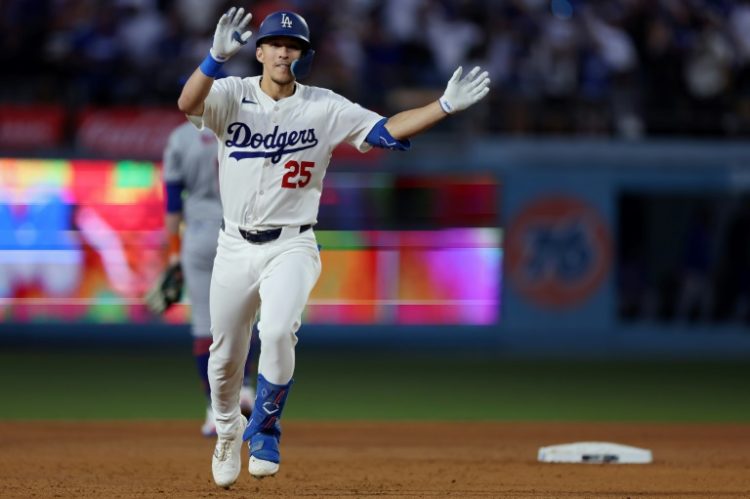 Tommy Edman of the Los Angeles Dodgers celebrates a two-run homer as he rounds the bases in a playoff victory over the New York Mets. ©AFP