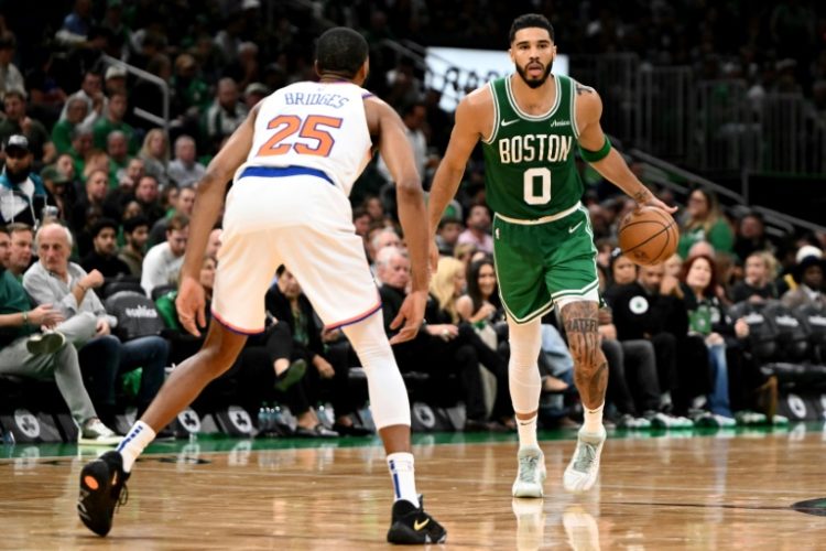 Jayson Tatum (right) turned in a dazzling performance as Boston opened their NBA campaign with a blowout of the New York Knicks. ©AFP