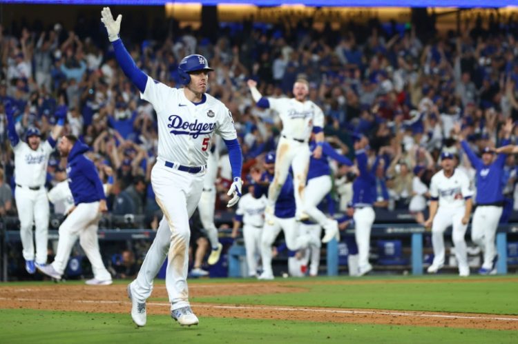 Freddie Freeman rounds the bases triumphantly after his walk-off grand slam for the Los Angeles Dodgers in game one of the World Series on Friday. ©AFP