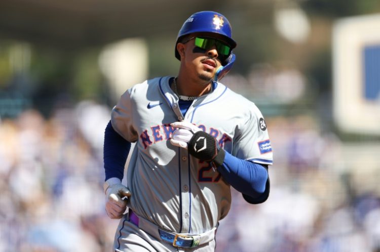 Mark Vientos of the New York Mets runs the bases after hitting a grand slam home run in a 7-3 victory over the Los Angeles Dodgers in game 2 of their MLB playoff series. ©AFP