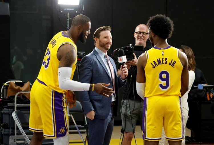 LeBron James (left) and eldest son Bronny (right) made their first appearance together for the Los Angeles Lakers in a pre-season game on Sunday. ©AFP