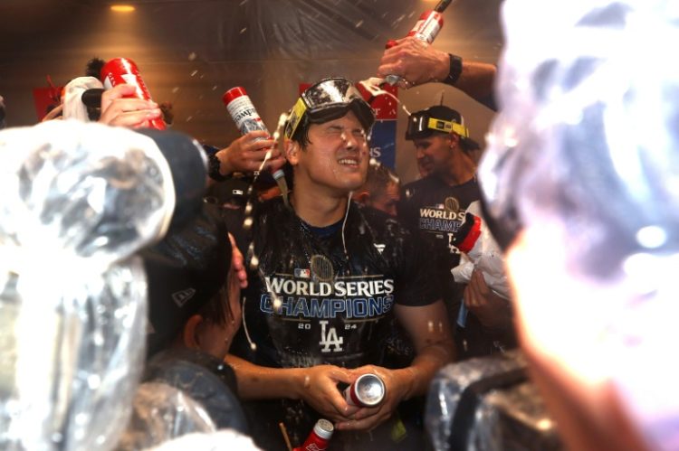 Shohei Ohtani celebrates with team-mates after the Los Angeles Dodgers World Series victory. ©AFP