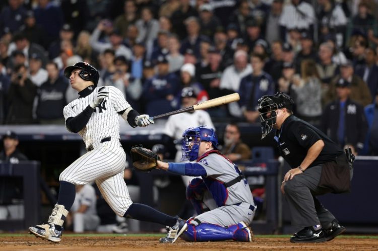 New York's Anthony Volpe hits a grand slam home run to put the Yankees ahead to stay in a World Series victory over the Los Angeles Dodgers. ©AFP