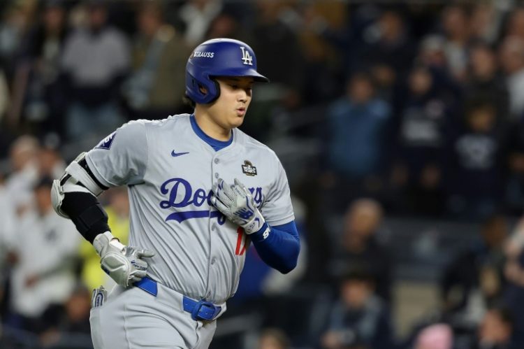 Japanese star Shohei Ohtani was the designated hitter for the Los Angeles Dodgers in a game-three victory over the New York Yankees despite suffering a partially dislocated left shoulder on Saturday. ©AFP