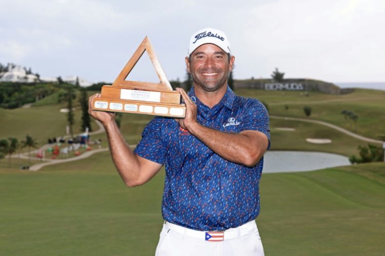 Rafael Campos of Puerto Rico poses with the trophy after winning his first US PGA Tour title on Sunday at the Bermuda Championship. ©AFP