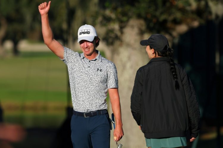 American Maverick McNealy celebrates after sinking a birdie putt on the 18th hole to win the US PGA Tour's RSM Classic. ©AFP