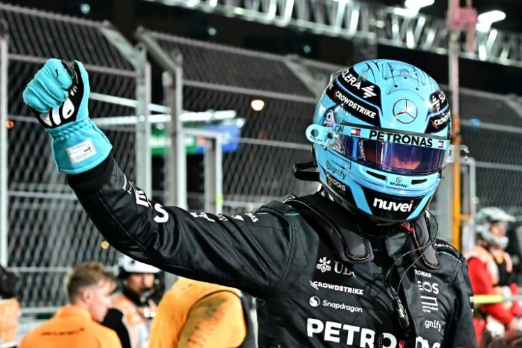 Fast show: Mercedes' George Russell celebrates securing pole position . ©AFP