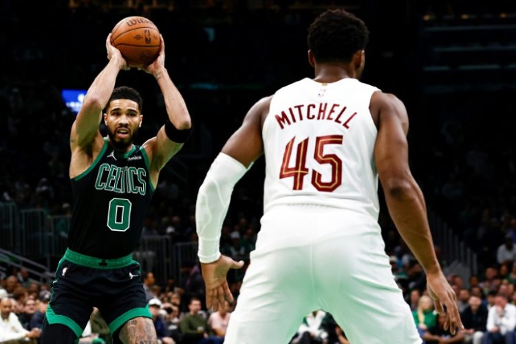 Jayson Tatum lines up a pass against Cleveland's Donovan Mitchell in the NBA Cup on Tuesday . ©AFP