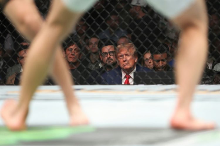 President-elect Donald Trump, seen here at a UFC fight in December 2023, professed a nostalgic vision of alpha male masculinity on the campaign trail that may have won him voters at the ballot box. ©AFP