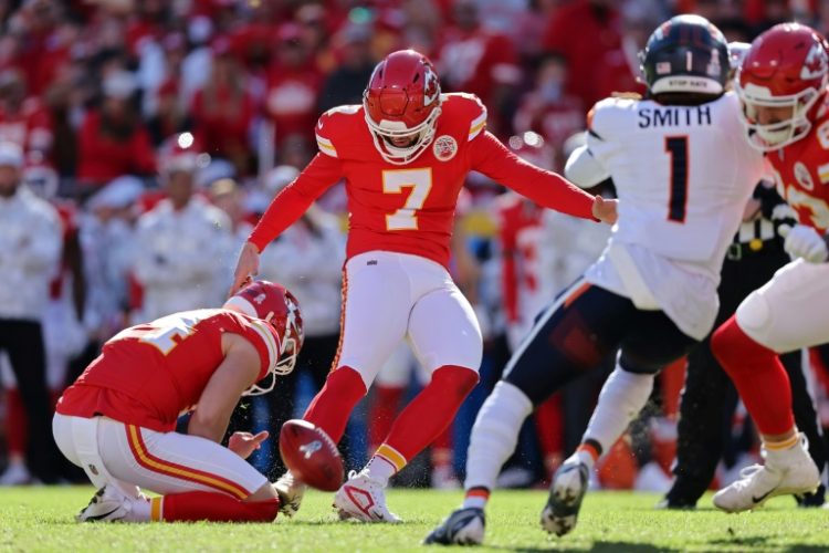 Kansas City Chiefs kicker Harrison Butker, attempting a field goal, will be sidelined for four games for the reigning NFL champions with a knee injury that requires surgery. ©AFP