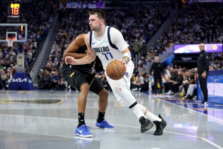 Slovenian guard Luka Doncic of the Dallas Mavericks will miss at least the next week of the NBA season with a right wrist sprain, the team announced. ©AFP