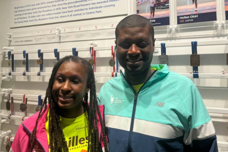 Jasmine Murrell (L) and husband Kevin Orcel, visually impaired runners from New Jersey who will run the New York City Marathon on November 3, pose in New York on October 8, 2024. ©AFP