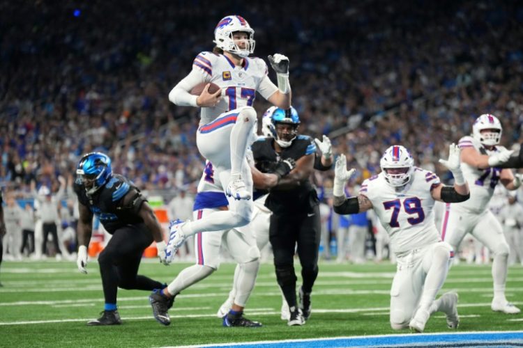 Josh Allen leaps into the end zone for a touchdown in Buffalo's victory over the Detroit Lions. ©AFP