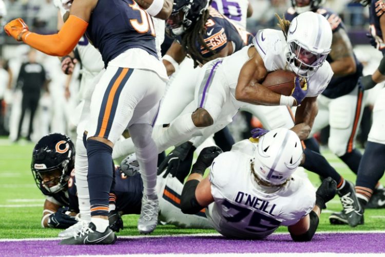 Aaron Jones of the Minnesota Vikings scores a third quarter touchdown in the Vikings' NFL victory over the Chicago Bears. ©AFP