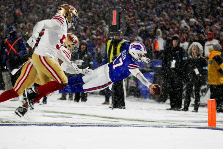 Josh Allen of the Buffalo Bills dives for a unique touchdown in the third quarter against the San Francisco 49ers on Sunday.. ©AFP