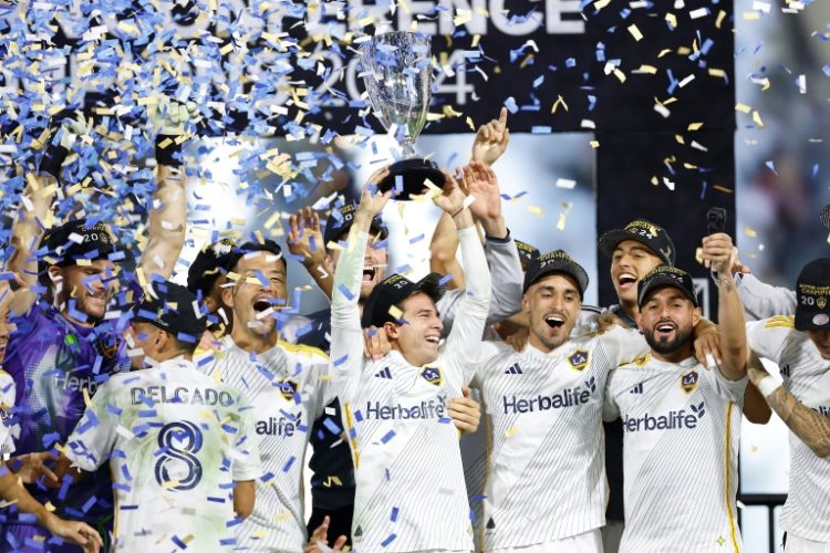 Los Angeles Galaxy players celebrate reaching this weekend's MLS Cup final, a year after the worst season in the club's history. ©AFP